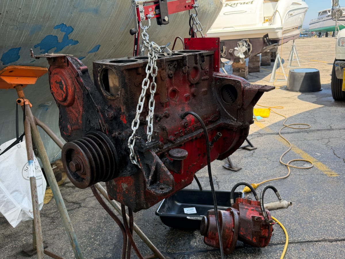 The original engine lifted out of Challenge in the boatyard